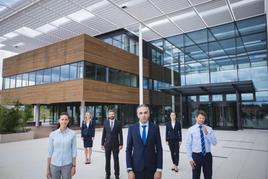 Group of business professionals outside office building